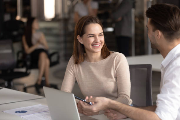 istock Happy female manager listening to confident male team leader. 1209105708