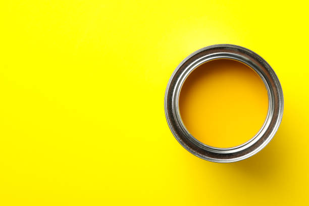 istock Paint can on yellow background, top view 1209105881