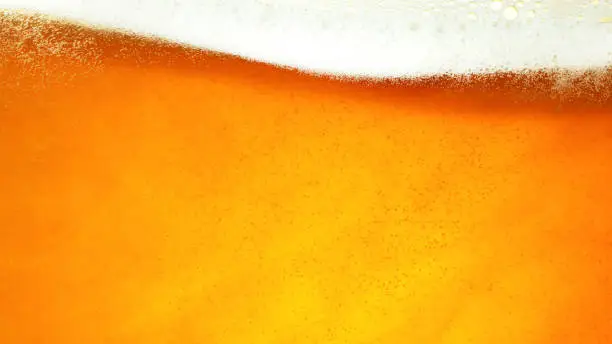 Detail of beer drink with foam head, super macro shot