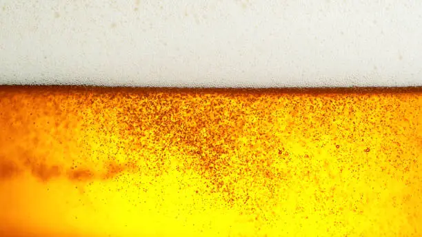Detail of beer drink with foam head, super macro shot