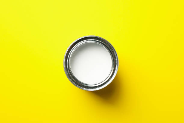 istock Paint can on yellow background, top view 1209106027