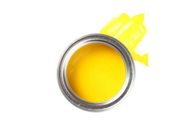 istock Can of yellow paint and stroke isolated on white background 1209107075