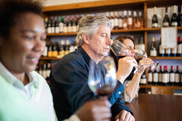 istock Group people tasting different types of wines 1209108181