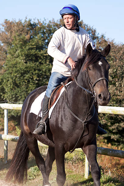 istock Jockey Riding Thoroughbred Horse 120910852