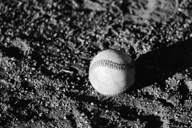 istock Baseball on dirt ball field 1209109831