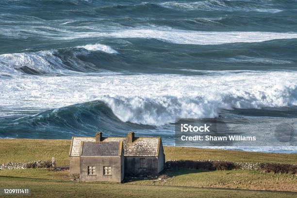 Rough Sea And A Lonely Cottage Stock Photo - Download Image Now - Ireland, Storm, Coastline