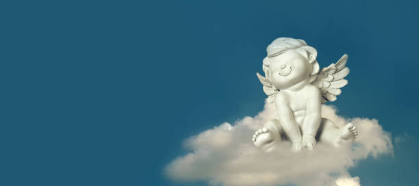 istock Guardian angel sitting on the cloud 1209113401