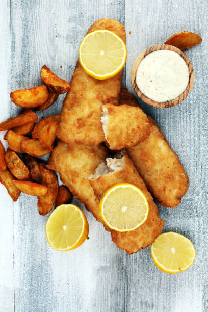 istock traditional British fish and chips consisting of fried fish, potato chips and mayonnaise 1209113775