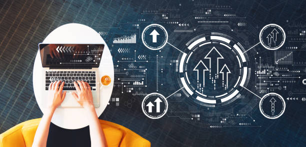 istock Rising arrow theme with person using a laptop 1209116109