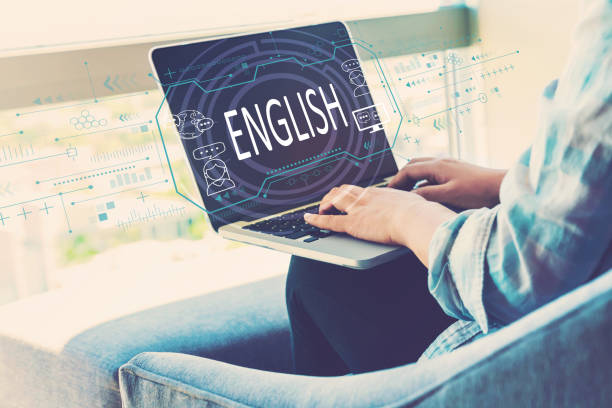 istock English concept with woman using laptop 1209116875