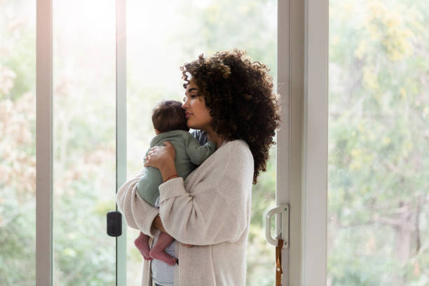 istock New mom comforts baby boy 1209117957