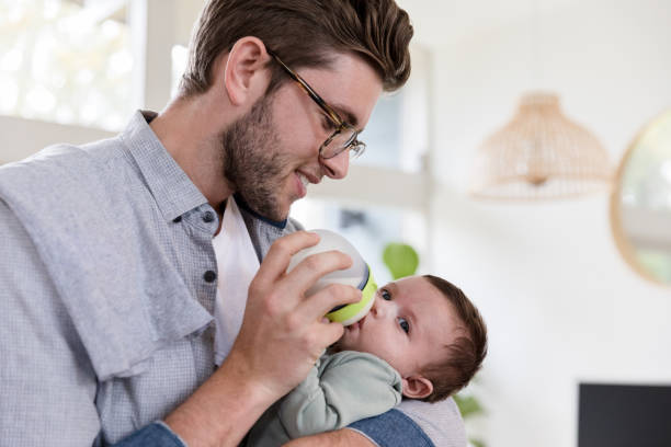 istock New father feeds his baby boy 1209118005