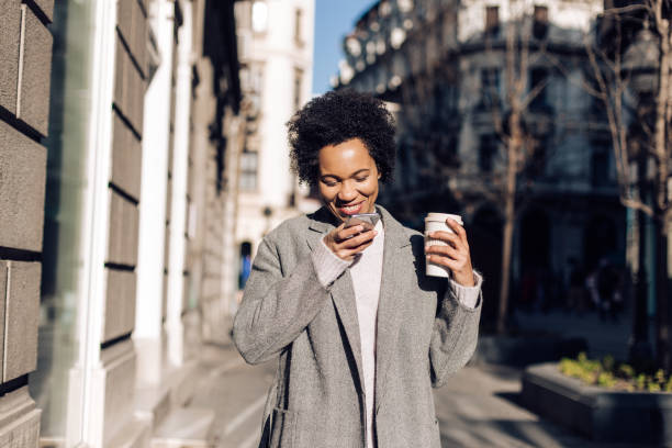istock Cheerful woman recordin a voice message 1209119401