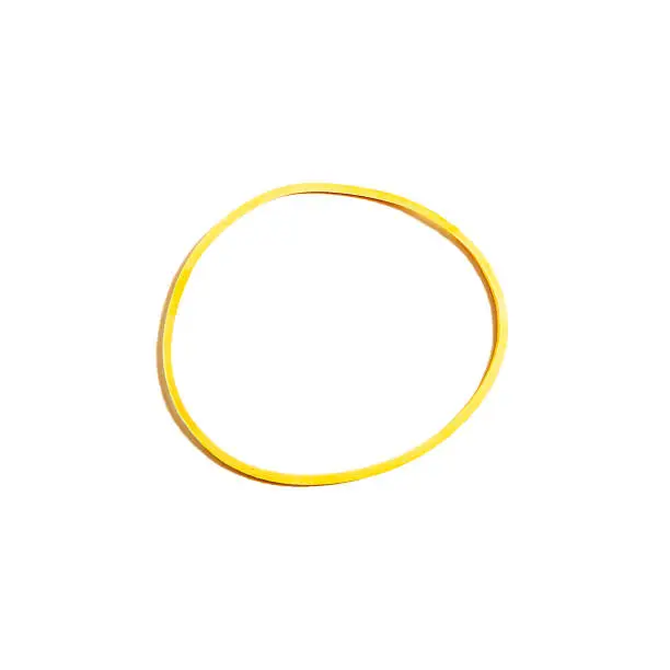 Photo of Yellow rubber band isolated on white background.
