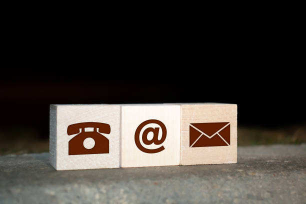 istock Website and Internet contact us page concept with colored icons on cubes on a keyboard 1209123391