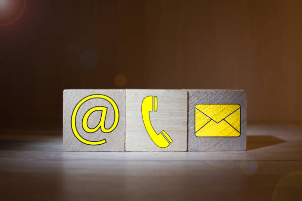 istock Website and Internet contact us page concept with colored icons on cubes on a keyboard 1209124049