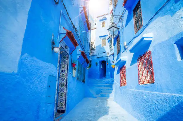 Photo of Beautiful street of blue medina in city Chefchaouen,  Morocco, Africa.