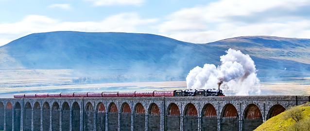 Steam train crossing the Ribblehead Viaduct, Yorkshire Dales, England, UK