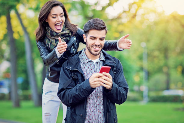 istock Young woman is surprising her date in the park 1209140969