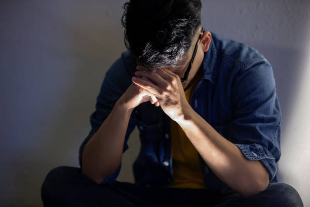 man upset and sit outdoor