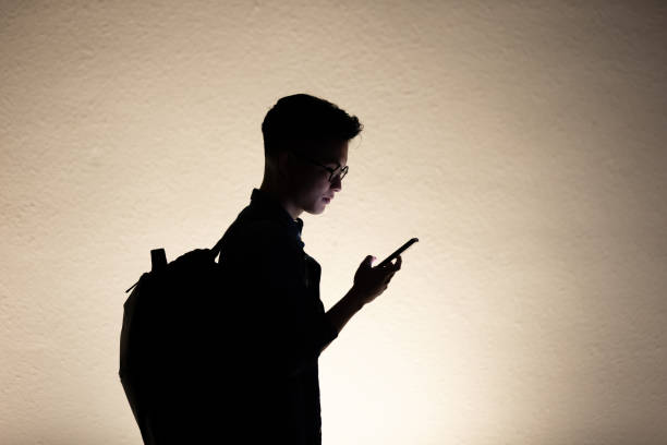 istock silhouette of man use phone 1209143002