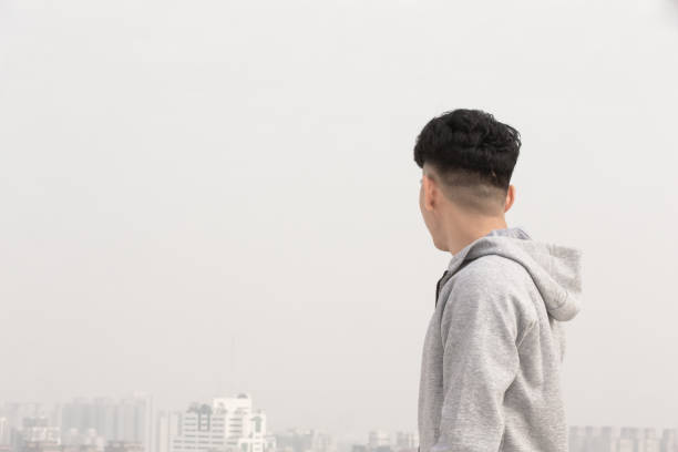 istock man look city in smog 1209143106