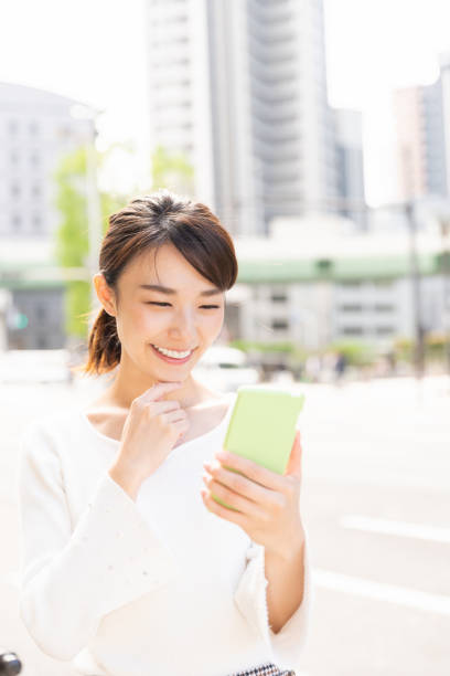 istock asian woman who see a smart phone 1209145227