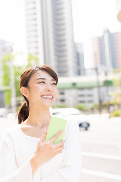 istock asian woman who see a smart phone 1209145331