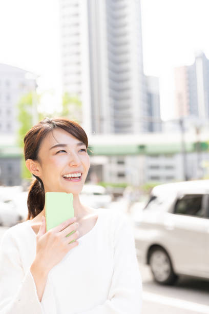 istock asian woman who see a smart phone 1209145880