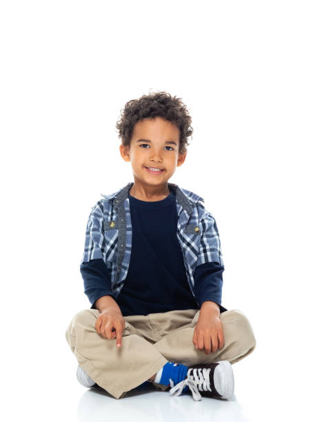 istock Boys sitting on floor in front of white background 1209146493
