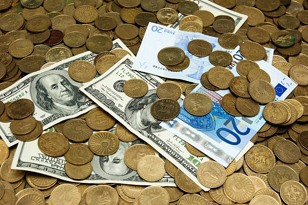 istock Dollars and Euros on the coins background 120914732