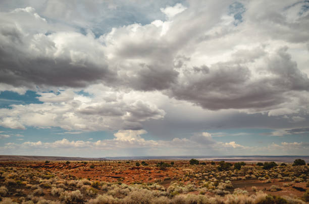 istock Dramatic cloudscape above the desert land of Arizona 1209147364