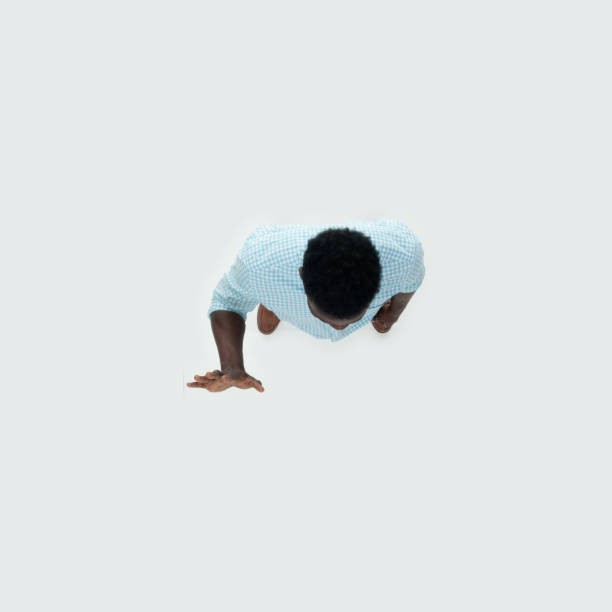 istock Caucasian young male standing in front of white background 1209147875