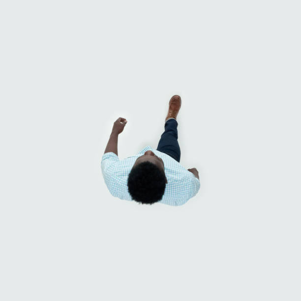 istock Caucasian young male walking in front of white background 1209147877