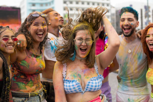 istock Painted tourists enjoy the carnival 1209149661