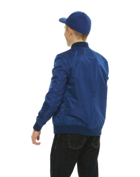 istock Caucasian boys in front of white background wearing baseball cap 1209149775