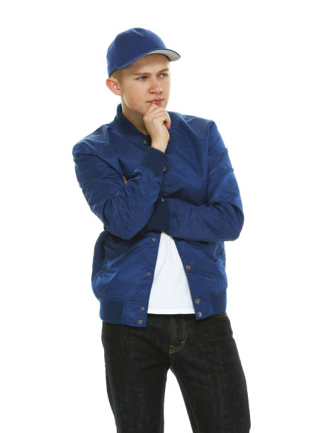 istock Caucasian boys in front of white background wearing baseball cap 1209149844