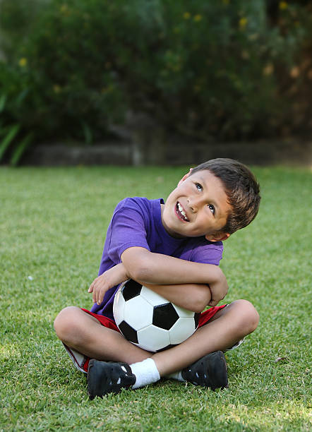 istock Happy young hispanic boy with soccer ball 120915154