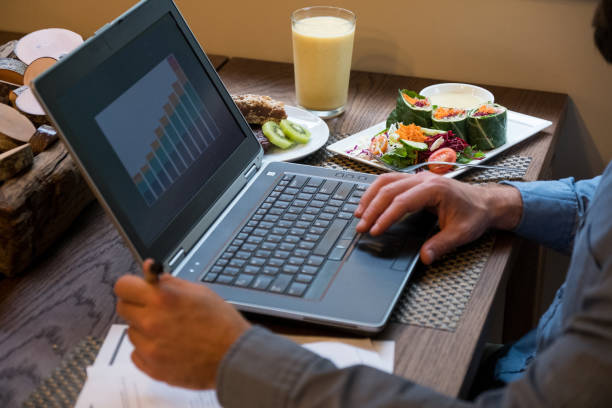 istock Close up of Man working from home on personal computer 1209154171