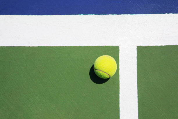 photo tennis ball on colorful ground stock photo
