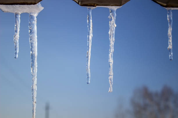 istock Icicles against the background of the blue sky 1209155178