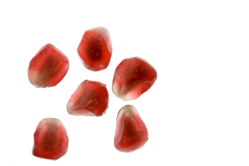 A close-up of pomegranate red seeds.