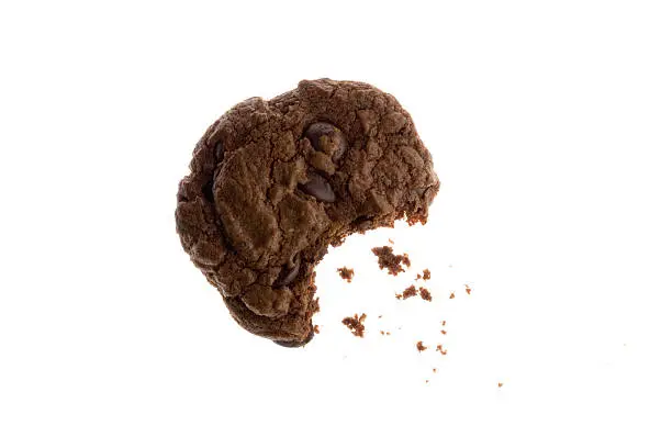 Close-up of a homemade chocolate cookie  with crumbs- White background.