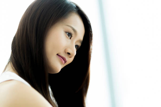 istock Young woman brushing hair 1209159337