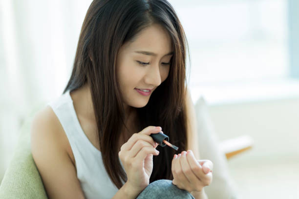 istock Young woman grooming nails 1209159383