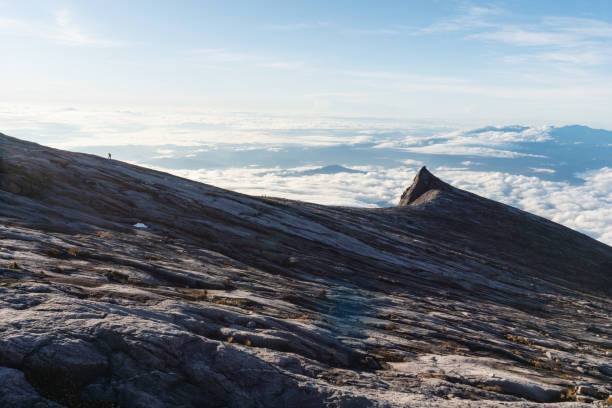 istock Mountain peak over clouds on Kota Kinabalu mountain in Malaysia 1209163325