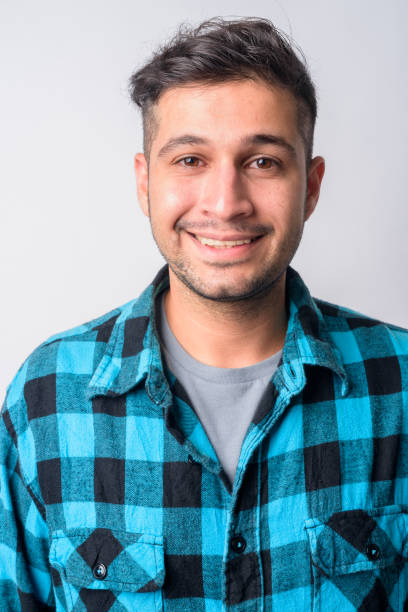 istock Face of happy young Persian hipster man smiling 1209164164