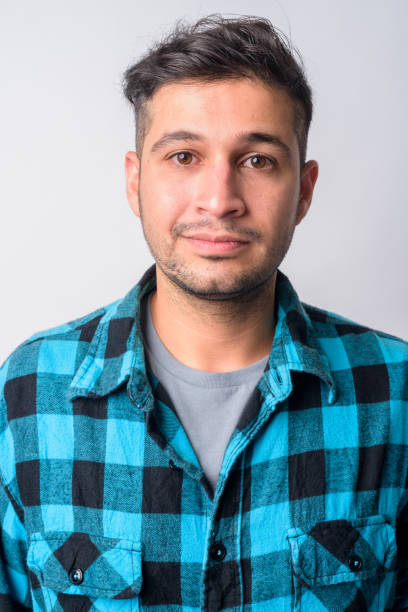 istock Face of young handsome Persian hipster man 1209164171