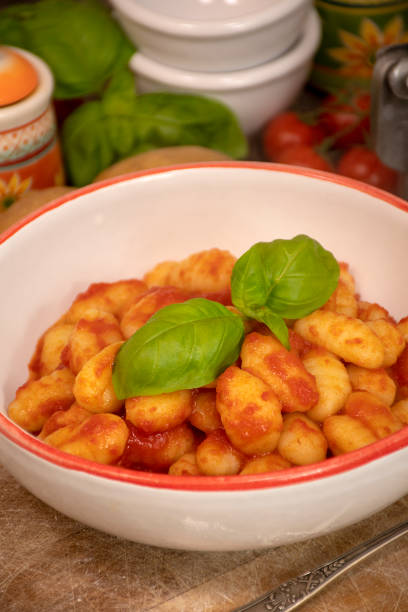 istock Homemade potato dumplings with tomato sauce 1209164913
