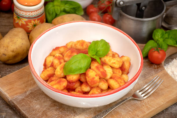 istock Homemade potato dumplings with tomato sauce 1209165085